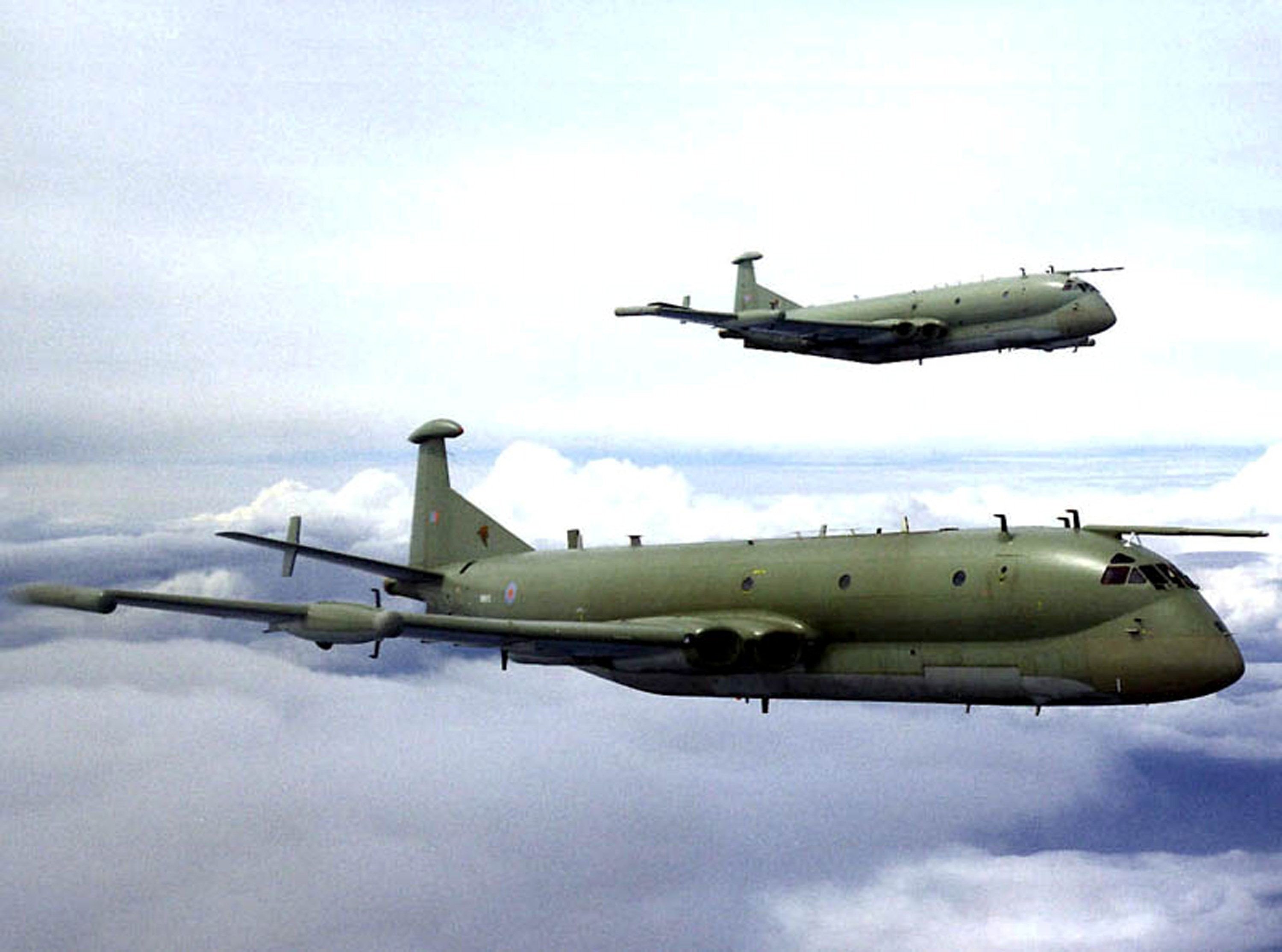 Two Royal Air Force Nimrod MR2s in echelon port formation.